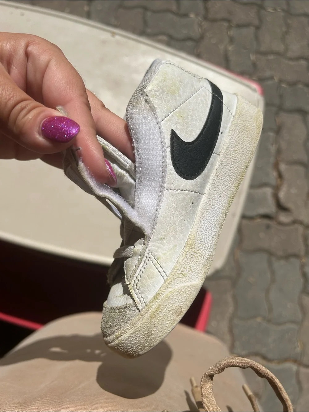 Nike Kids White High-Top Sneakers with Black Swoosh and Orange Tongue Accent